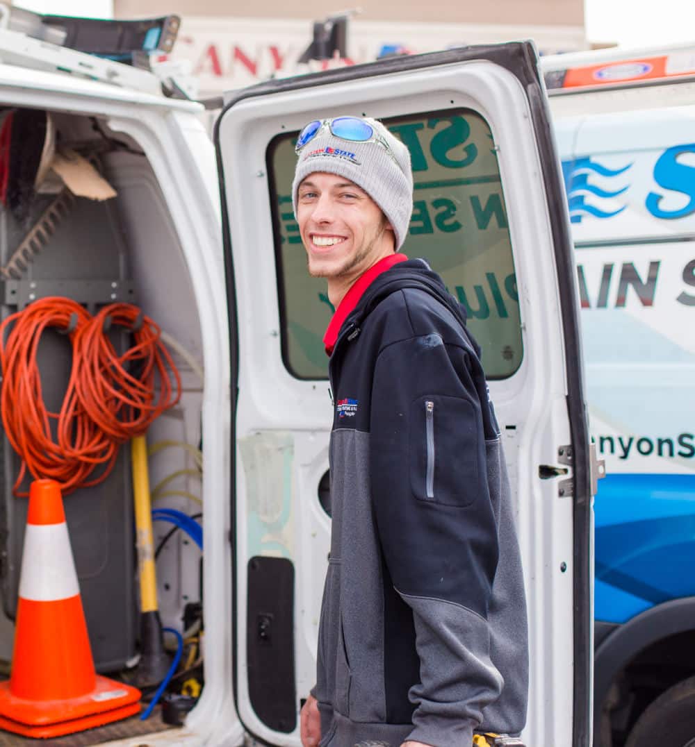 canyon state plumber smiling at the camera